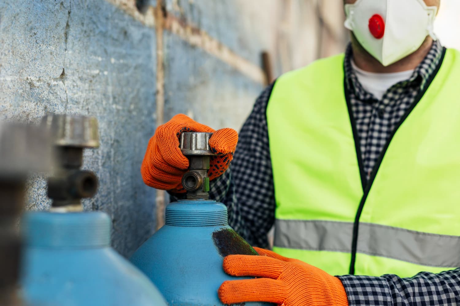 Technician working with gas cylinders